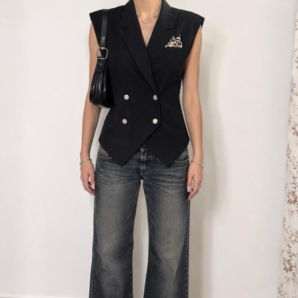 Black vest with gold buttons